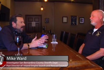 Ron Stark sits with Mike Ward, Investigator San Bernardino County Sheriffs Dept.